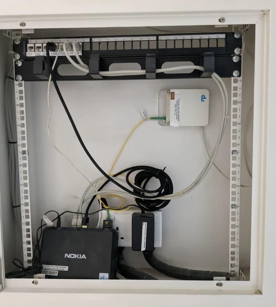 12U Network cabinet with the ISP router, mostly empty